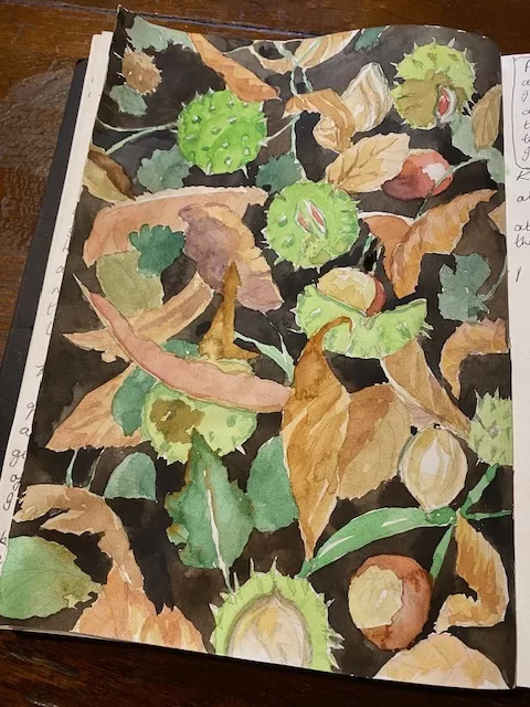 creating a random but decorative pattern of leaves and conkers